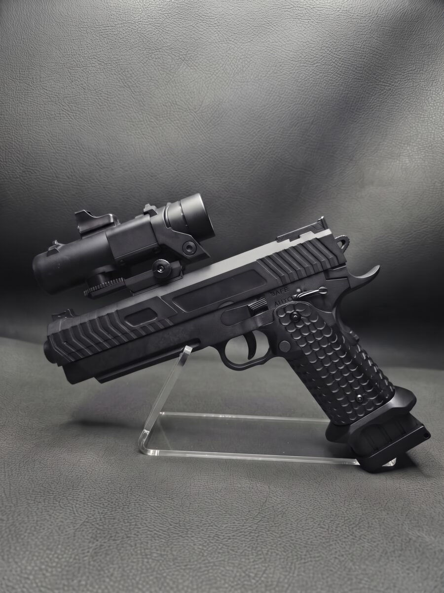 Manual and automatic tactical water bead blaster toy gun with optical scope on stand.