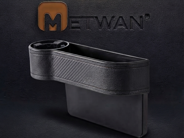 Side view of a black car seat organizer with a built-in cup holder and carbon fiber texture design