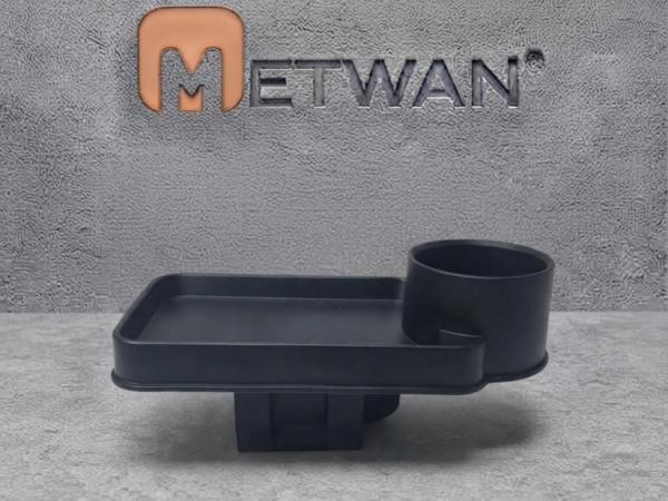 Front view of a black car cup holder with a detachable food tray